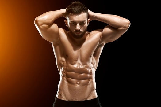 Muscular bodybuilder guy doing posing photo