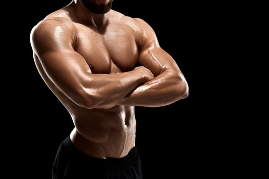 Muscular bodybuilder guy doing posing photo