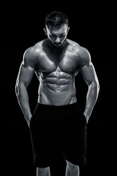 Muscular bodybuilder guy doing posing photo