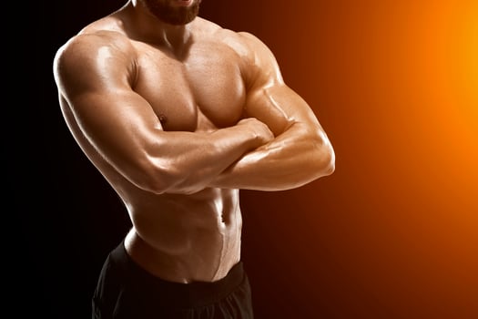 Muscular bodybuilder guy doing posing photo