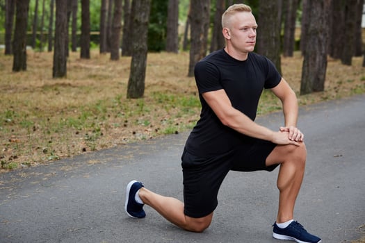 young athlete running in the forest photo