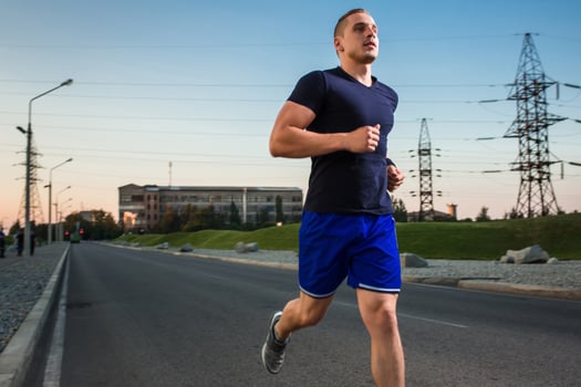 Close-up portrait of athletic man running photo