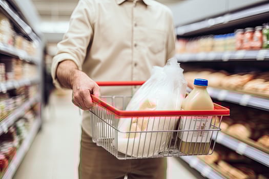 AI generated Man holding shopping basket with bread and milk groceries in supermarket. AI Generated photo