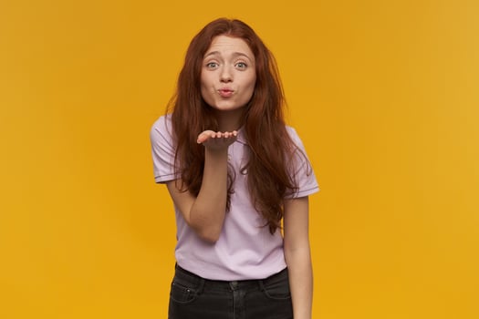 girl standing over yellow background photo