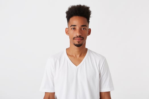 Portrait of serious handsome african american young man with afro hairstyle photo