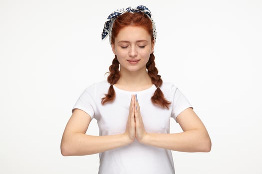 ginger young female meditating and calm photo