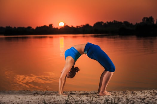 yoga at sunset on the beach. photo