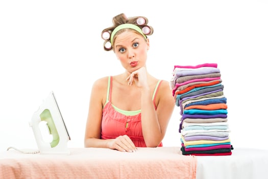 Overworked housewife ironing photo