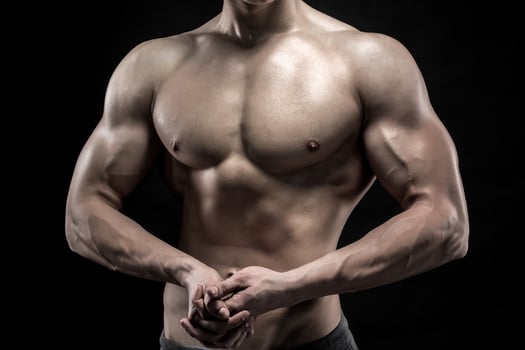 Close-up of man model torso posing showing perfect body photo