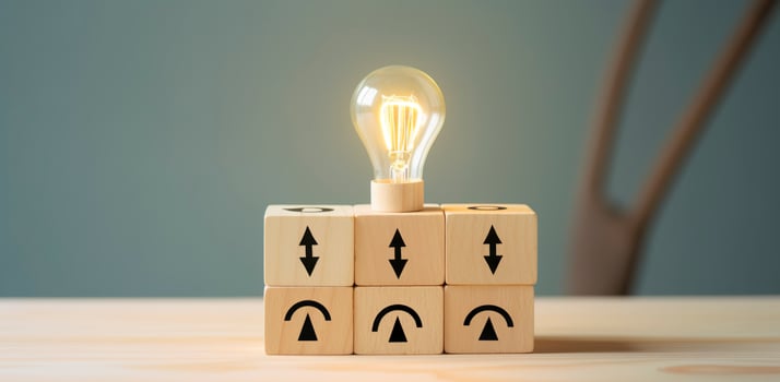 AI generated Creative idea, solution and innovation concept. Idea generation for business development. Wooden cube blocks with light bulb and cycle icons on clean background and copy space. photo
