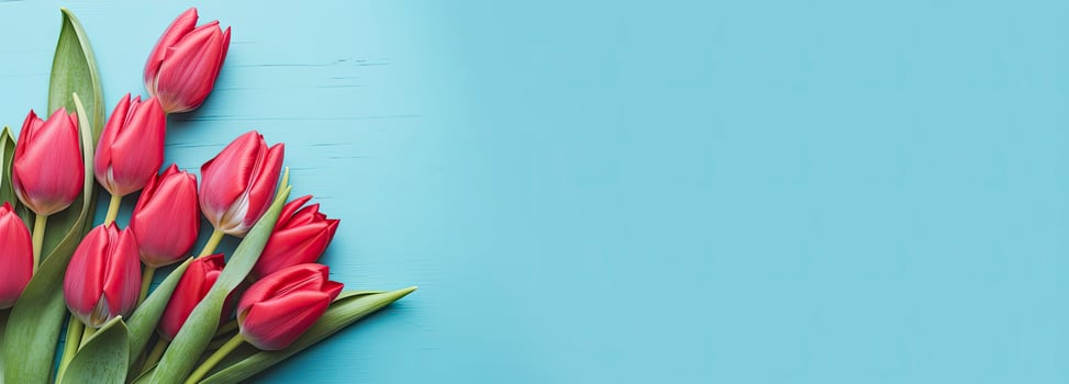 AI generated Bouquet of red tulip on blue Background. Top view with copy space. photo