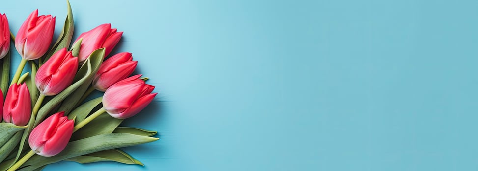 AI generated Bouquet of red tulip on blue Background. Top view with copy space. photo