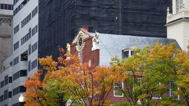 The beautiful campus autumn view with the colorful trees and leaves in the rainy day photo