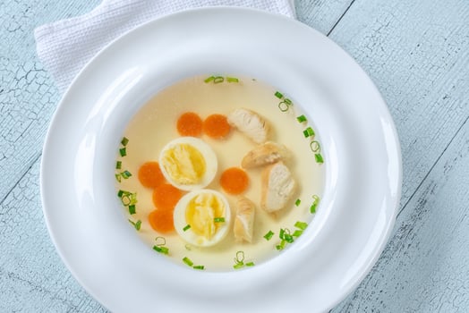 Chicken broth in plate photo