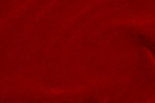 Red silk fabric texture used as background. red panne fabric background of soft and smooth textile material. crushed velvet .luxury scarlet for velvet.. photo