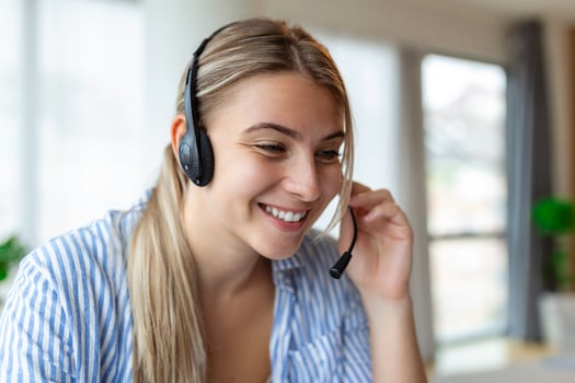 Business woman with headsets working with computer at office. Customer service assistant working in office.woman operator working with headsets and laptop at telemarketing customer service. photo