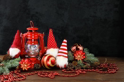 Grey background with christmas decorations, dolls and copy space photo
