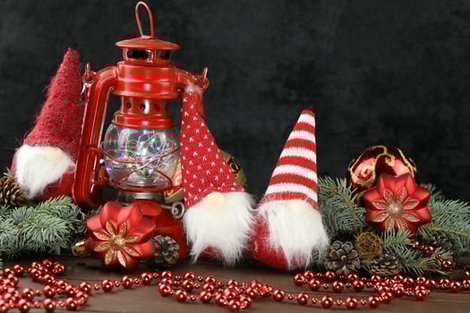 Grey background with christmas decorations, dolls and copy space photo