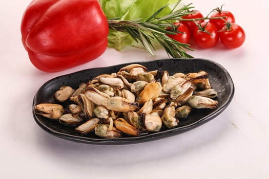 Marinated mussels in the bowl photo