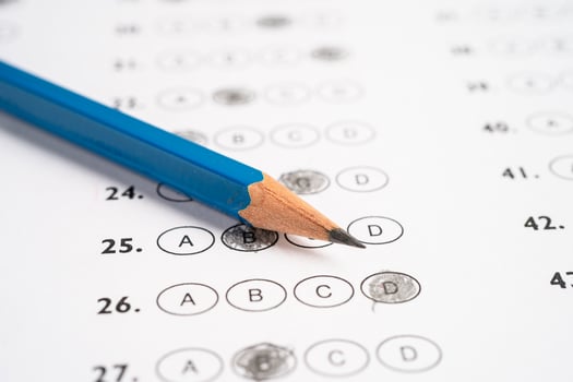 Answer sheets with pencil drawing fill to select choice, education concept. photo