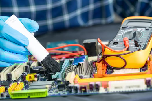 Asian technician repair and cleaning dirty micro circuit main board of smartphone electronic technology with brush, hardware, mobile phone, upgrade concept. photo