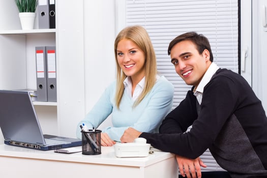 Happy businessman and businesswoman working photo