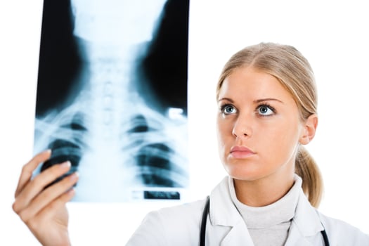 Doctor looking at x ray image photo