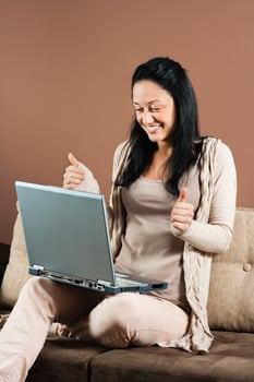 Young woman using laptop photo