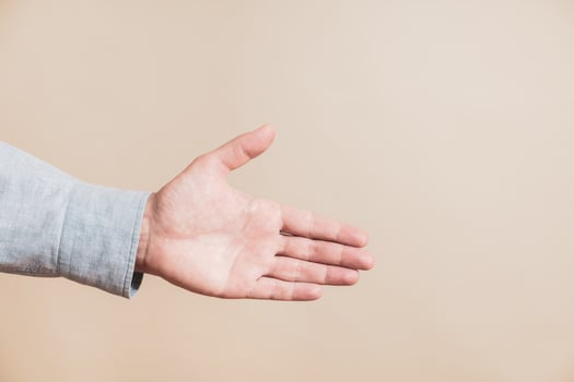 Close up image of male hand showing handshaking gesture. photo