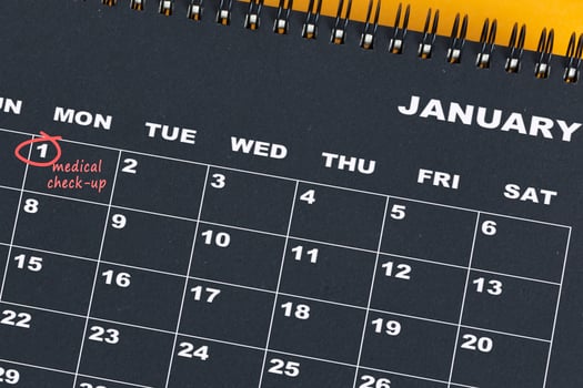 Red circle mark on the calendar at 1 for reminder of medical check up. photo