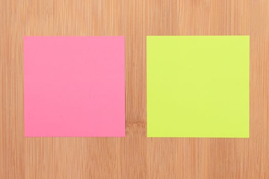 Colored Sticky Notes with Copyspace Pinned to the Wooden Message Board. To Do List Reminder in Office. Blank Memo Sticker at Work Template. Empty Checklist Mockup photo