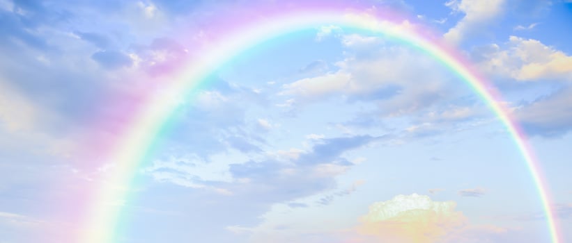 Beautiful rainbow with clouds and blue sky photo