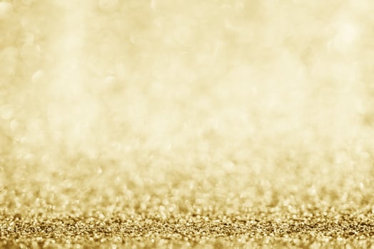 Abstract gold glitter sparkle blurred with bokeh background photo