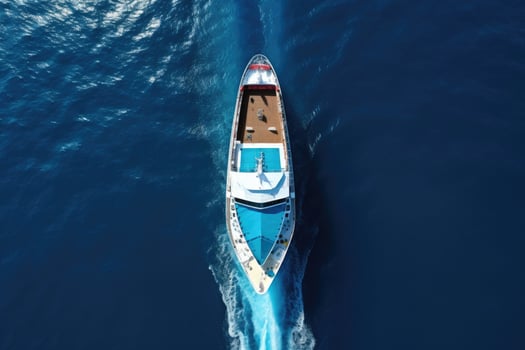AI generated Aerial view of a luxury yacht sailing in the deep blue sea, Aerial top down view of a cruise ship bow traveling over blue ocean, AI Generated photo