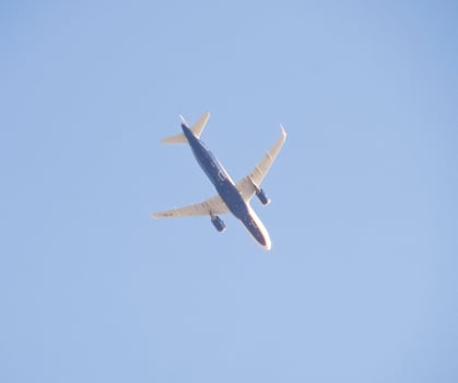 Passenger aircraft in the sky at low altitude flies to the airport to land. photo