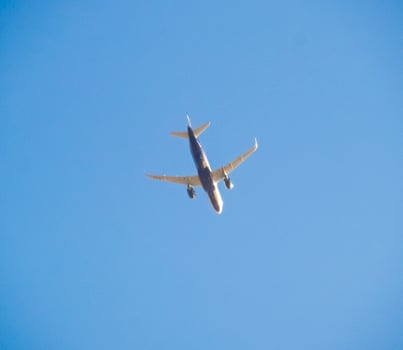 Passenger aircraft in the sky at low altitude flies to the airport to land. photo