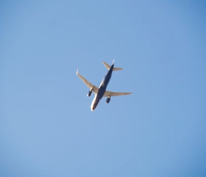 Passenger aircraft in the sky at low altitude flies to the airport to land. photo