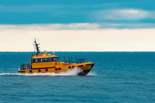 Orange pilot ship moving fast in Baltic sea. Europe photo