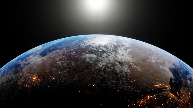 The sun drifts across frame as the earth turns, revealing the continents at night. Image from NASA. 3D render of sunrise over planet earth. Rendered 3D illustration photo