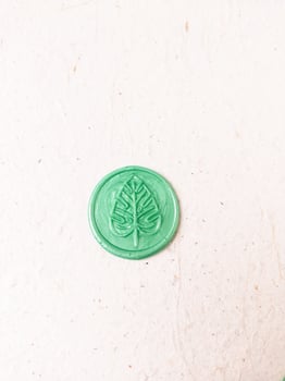 wax seal stamp on white paper background. Top view. Copy space. photo