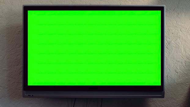 Flat screen TV with green screen composited. TV or television - green screen - room - on the wall. LCD TV with track green screen in modern livingroom photo