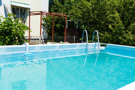 Private swimming pool at summertime photo