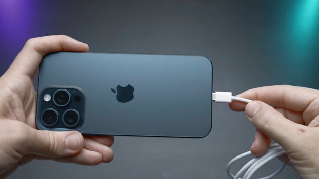 China, Beijing - September 15, 2023.Wire type C in new iPhone. Action. USB-C connector in new iPhone model 15 pro. Flagship in world of iPhones with new Type C charging connector in model 15 pro photo
