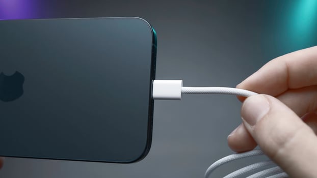 China, Beijing - September 15, 2023.Wire type C in new iPhone. Action. USB-C connector in new iPhone model 15 pro. Flagship in world of iPhones with new Type C charging connector in model 15 pro photo
