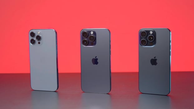 New York - September 15, 2023. iPhones of different generations in comparison. Action. Comparison of new iPhone 15 with versions 14 and 13 generations. Design of iPhones 13, 14 and 15 promax versions photo