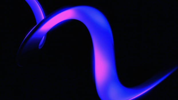 Colorful spinning spiral on a black background. Design. Curving 3d stripe with gradient effect. photo