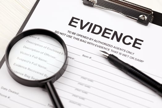 Evidence report blank on A4 tablet lies on office table with pen and magnifying glass photo