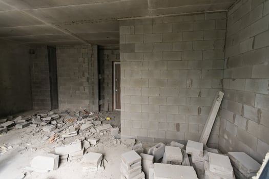 Wall smashed into debris room in apartment ready for renovation with destroyed smashed wall demolish photo