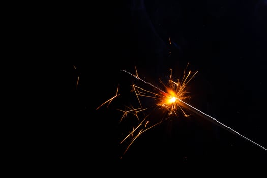 closeup view of burning sparkler photo