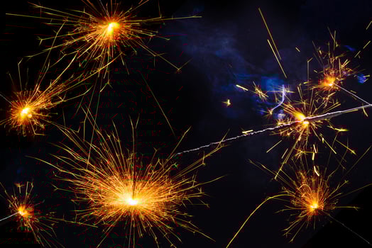 A lit sparkler showing bright sparks photo